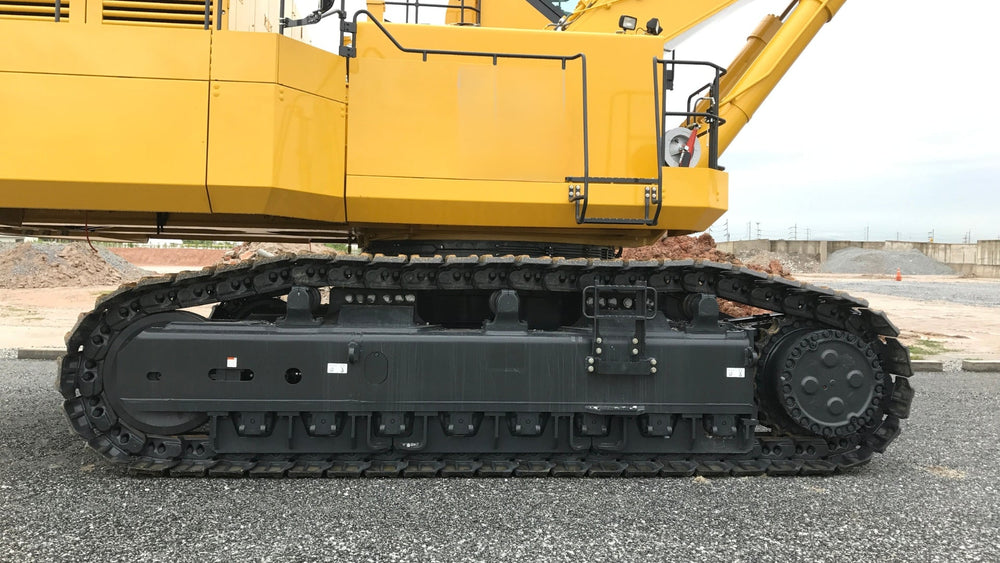 Close up of the undercarriage for a Komatsu PC2000 excavator.