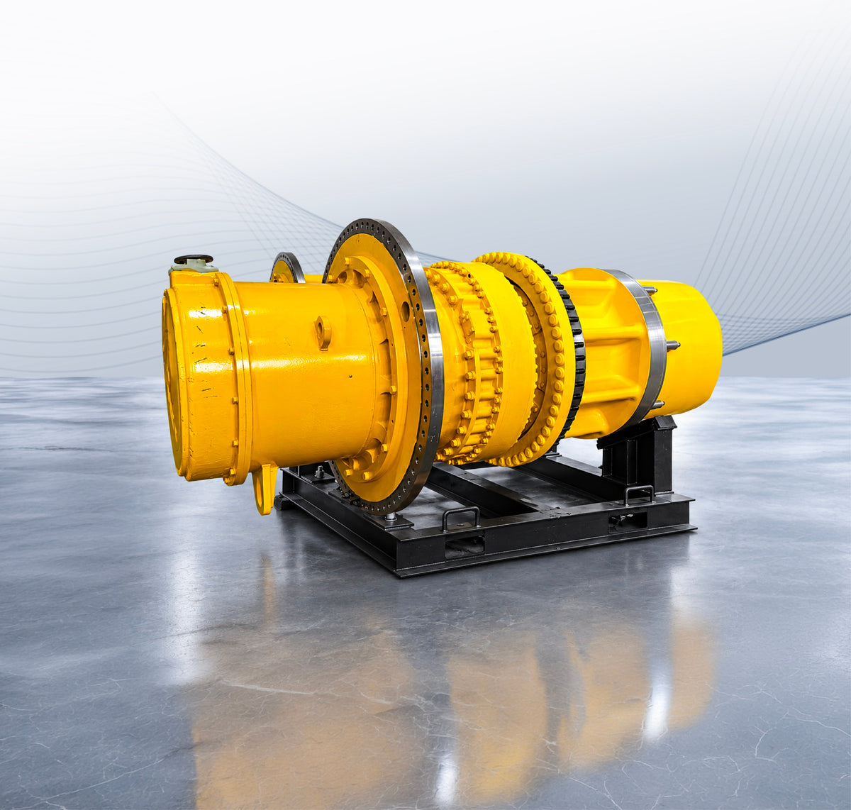 Yellow wheel motor assembly with bolted flanges mounted on a black steel transport stand.